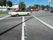 1970 Ford Ranchero - A 1969 Mercury Cougar XR7 convertible turns at an intersection on a sunny day.
