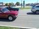 1970 Ford Ranchero - Two classic American cars, a red Mustang and a dark Torino, on the road.