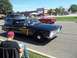1970 Ford Ranchero - A vintage Detroit Police wagon cruises down the street, accompanied by a classic red convertible.