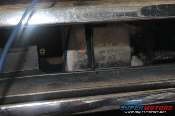 Close-up of electrical components and wiring inside a vehicle