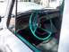 1970 Ford Ranchero - The interior of a classic truck features a turquoise steering wheel and matching trim accents.