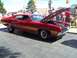 1970 Ford Ranchero - A red 1970 Ford Ranchero is displayed with its hood open, showing the engine bay.