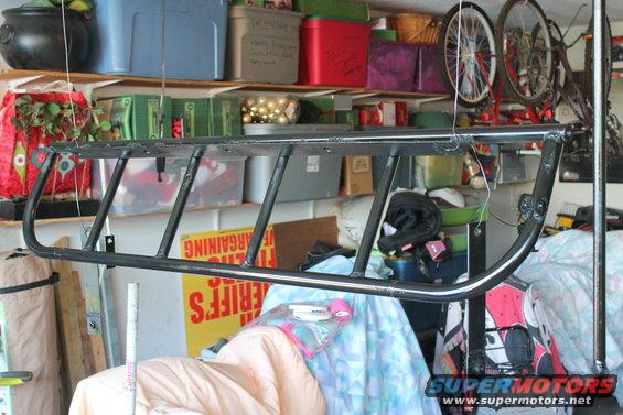 Black light cage hanging in garage