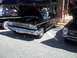 1970 Ford Ranchero - A classic black Ford Galaxie is displayed with its hood up at an outdoor event.