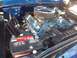 1970 Ford Ranchero - The engine bay of a blue vehicle features chrome valve covers and a prominent air filter.