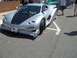 1970 Ford Ranchero - A highly modified silver sports car with a custom body kit is parked on asphalt.