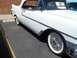 1970 Ford Ranchero - A white convertible is seen from the side, with a sign on the windshield indicating it is a 1956 El Morocco.