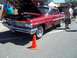 1970 Ford Ranchero - A classic red Pontiac Bonneville is displayed with its hood up, showing the engine compartment.