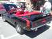 1970 Ford Ranchero - This black convertible features red racing stripes and a 'cuda' badge, indicating it is not a Ford Ranchero.
