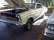 1970 Ford Ranchero - A vintage Mercury Comet is shown with its hood up, parked outdoors next to another vehicle.