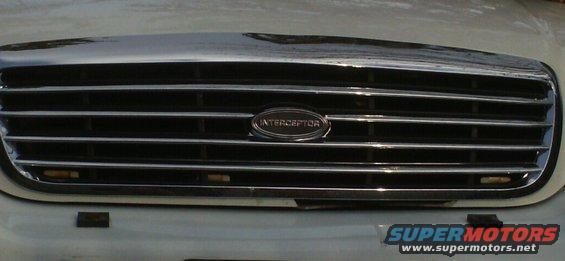 imag0082.jpg wish the cops had replaced that broken  part of the front end, gonna have to  bondo it, that part is like 150$  the new grille was much cheaper  like 35$ off Amazon.  
 I ditched all the ford emblems on her in favor of the interceptor emblem. No sense endorsing a company that abandons  its best selling car to push a car no one  really likes or wants (Taurus) .