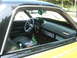 1972 Ford Ranchero - The interior of a car features a unique chain-wrapped steering wheel and custom dashboard accents.