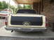 1972 Ford Ranchero - Rear view of a 1972 Ford Ranchero, showing the tailgate and bumper. A second vehicle is visible in the background.