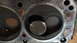 1973 Ford Torino - This is a close-up view of an engine cylinder head, showing combustion chambers and valves.