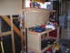 1997 Ford F-250 - A cluttered workbench in a garage setting, various tools and storage solutions.