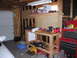 1997 Ford F-250 - Workbench in a garage with tools, storage bins, and a red Craftsman tool chest.