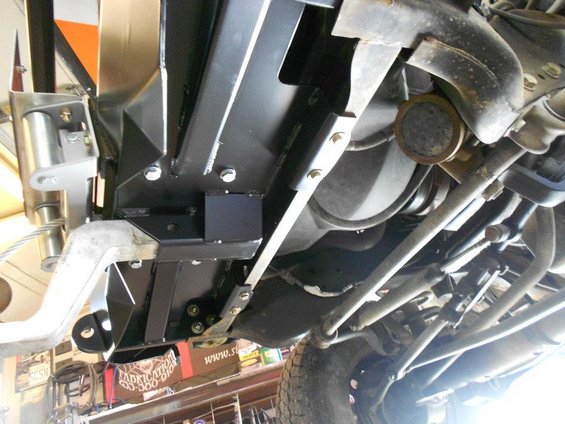 Underbody view of a vehicle with visible suspension components and exhaust system