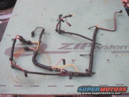 Vehicle wiring harness laid out on a green board