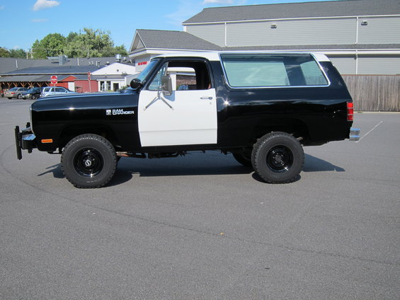 Black and white two-tone 1987 Dodge Ramcharger SUV parked on asphalt