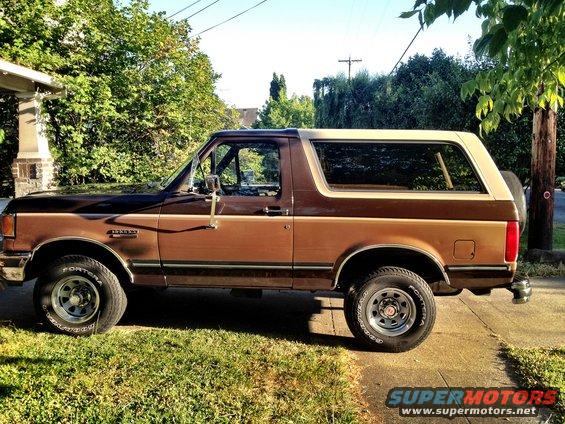 Brown and tan 1991 Ford Bronco parked on a driveway
