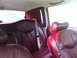 1997 Lincoln Town Car - Interior view of a car's red leather seats and headrests.