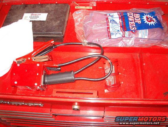 31top.jpg Overflow

Soldering gun (in box)
Battery load tester (same color red as the tool box)