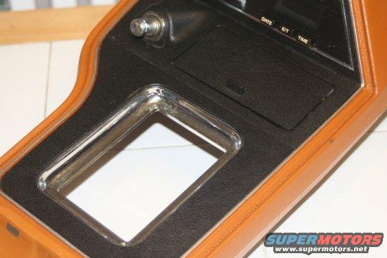 Center console with chrome trim and digital clock display