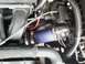 2000 Dodge Neon - Engine bay components including hoses and wiring are visible in this close-up shot.