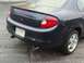2000 Dodge Neon - Rear view of a dark blue 2000 Dodge Neon sedan, dual exhaust pipes and a subtle spoiler.