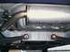 2000 Dodge Neon - Underside view shows the exhaust system and rear suspension components of a vehicle.
