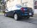 2000 Dodge Neon - Rear view of a dark blue 2000 Dodge Neon sedan with dual exhaust pipes.