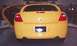 2000 Dodge Neon - Rear view of a yellow Dodge Neon with the driver's side door open.