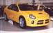 2000 Dodge Neon - A yellow Dodge Neon SRT-4 is displayed with its driver's door open, its sporty design.