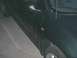 2000 Dodge Neon - The side profile of a dark vehicle is captured in this photograph.