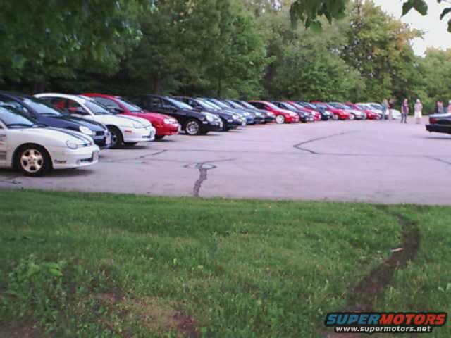 White 2000 Dodge Neon parked in a line of cars