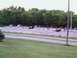 2000 Dodge Neon - A parking lot scene with numerous vehicles gathered under a tree line.