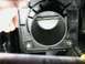 2000 Dodge Neon - Close-up of a vehicle's throttle body, with the Supermotors.net logo visible at the bottom right.