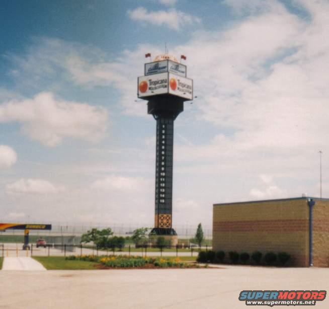 Tropicana tower scoreboard with a red car in the distance
