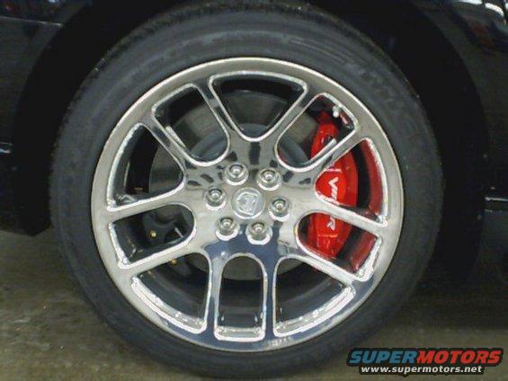 Chrome wheel with red brake caliper showing 'Viper' text