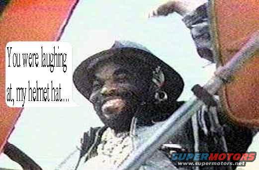 Man with beard wearing a hat and headphones, with text bubble "You were laughing at, my helmet hat..."