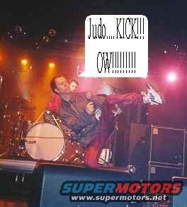 Stage performance with a man kicking and a text bubble saying "Judo...KICK!!! OW!!!!!!!"