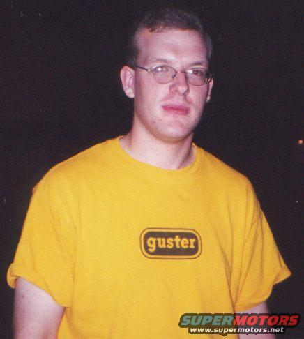 guy wearing a yellow t-shirt with 'guster' logo