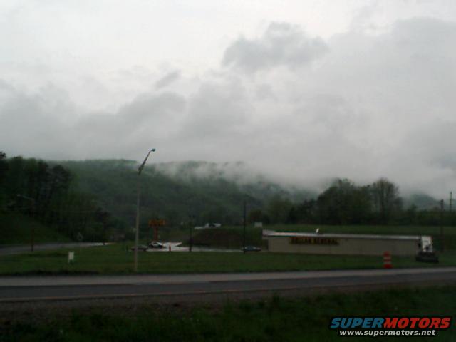 Dollar General store with a cloudy, mountainous background