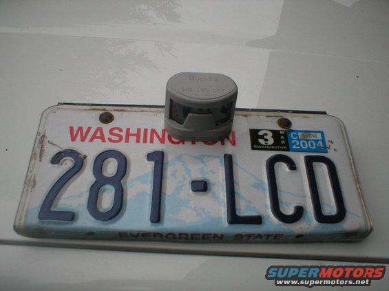 Washington license plate 281-LCD with a gray device on top