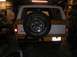 1978 Ford Bronco - The rear of a 1978 Ford Bronco is visible, a spare tire mounted externally.