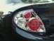 2000 Dodge Neon - Close-up of a dark blue car's taillight assembly, showing the red and clear lens components.