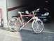 2000 Dodge Neon - A red bicycle is parked in front of a dark 2000 Dodge Neon.
