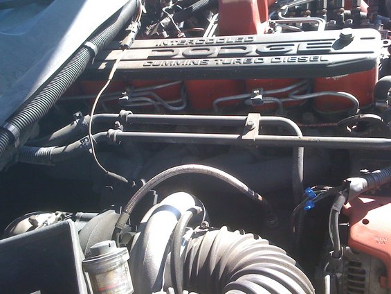 Close-up of a Dodge Cummins Turbo Diesel engine valve cover with fuel lines