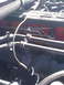 1997 Dodge 3500 - Close-up view of engine components, including hoses and metal tubing.