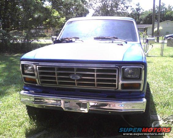 Front view of a blue Ford pickup truck, possibly from the early 1980s